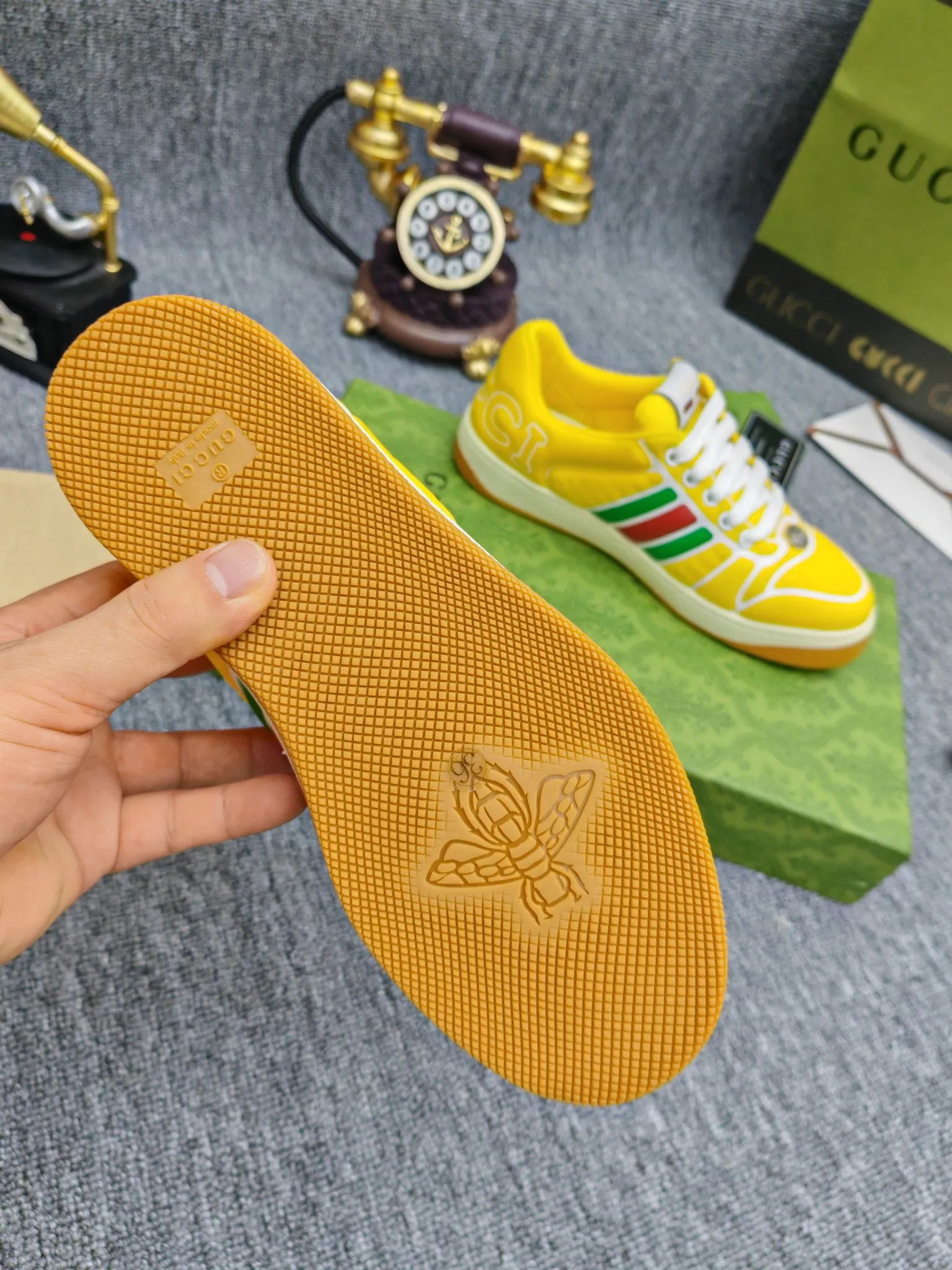 Factory price 600💰Screener series embellished web sneakers. This item is from the Gucci Lido series. Its design is inspired by the summer style and beach clubs of the Italian coast. The Screener series of sneakers draws inspiration from classic sneakers from the 1970s and takes its name from a special defensive move in sports. This shoe from the 2024 Pre-Fall collection is crafted from yellow rubber, a technical and malleable opaque material, with striped webbing on the sides and an embossed Gucci printed logo on the heel. Yellow rubber, opaque and technological in appearance. Red and green webbing decorated with metal Double G oval enamel details. Gucci printed embossed logo. Women 35-40, men 38-45, (men 38 and 45 need to be customized)